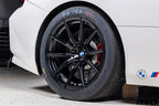 BMW Motorsport G87 M2 Racing black 18x10 wheel set installed on a BMW M2 Racing race car, featuring lightweight motorsport construction, track-focused fitment, and factory BMW Motorsport engineering.