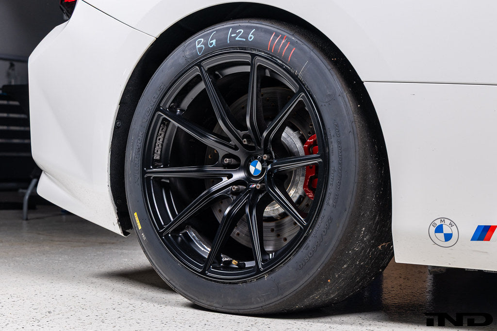 BMW Motorsport G87 M2 Racing black 18x10 wheel set installed on a BMW M2 Racing race car, featuring lightweight motorsport construction, track-focused fitment, and factory BMW Motorsport engineering.