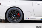 BMW Motorsport G87 M2 Racing black 18x10 wheel set installed on a BMW M2 Racing race car, featuring lightweight motorsport construction, track-focused fitment, and factory BMW Motorsport engineering.