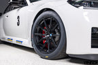 BMW Motorsport G87 M2 Racing black 18x10 wheel set installed on a BMW M2 Racing race car, featuring lightweight motorsport construction, track-focused fitment, and factory BMW Motorsport engineering.