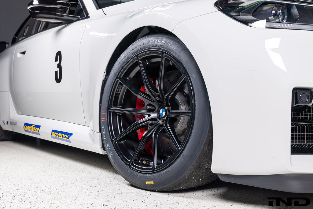 BMW Motorsport G87 M2 Racing black 18x10 wheel set installed on a BMW M2 Racing race car, featuring lightweight motorsport construction, track-focused fitment, and factory BMW Motorsport engineering.