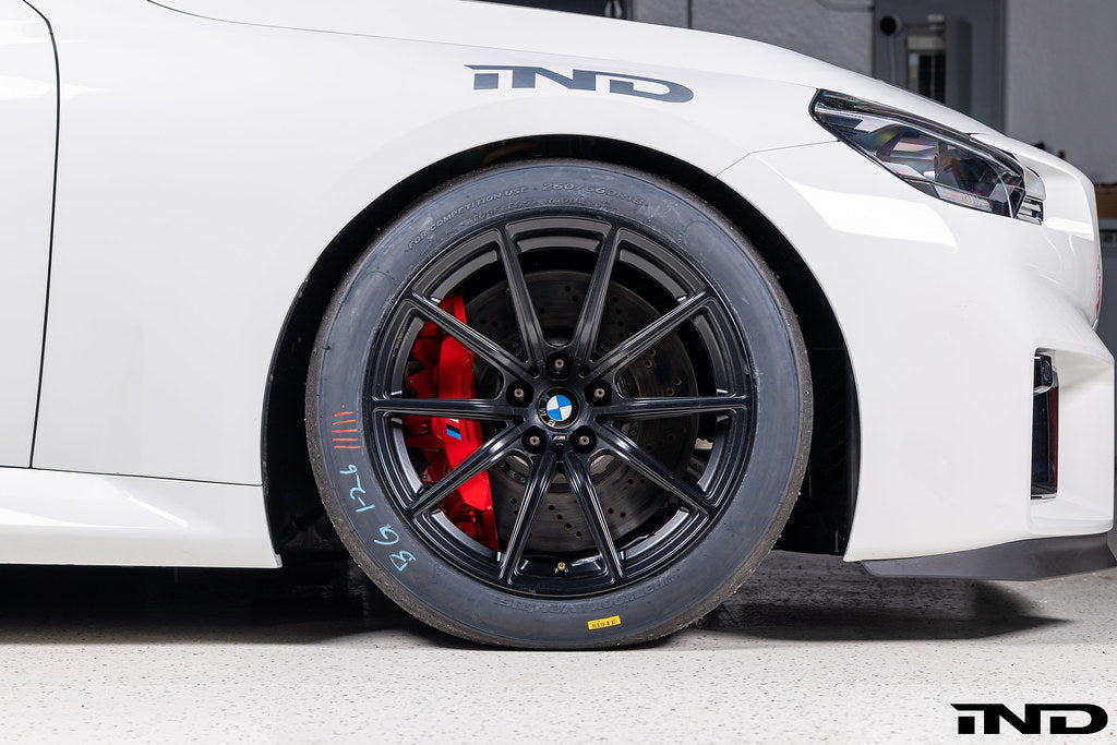 BMW Motorsport G87 M2 Racing black 18x10 wheel set installed on a BMW M2 Racing race car, featuring lightweight motorsport construction, track-focused fitment, and factory BMW Motorsport engineering.