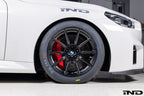 BMW Motorsport G87 M2 Racing black 18x10 wheel set installed on a BMW M2 Racing race car, featuring lightweight motorsport construction, track-focused fitment, and factory BMW Motorsport engineering.
