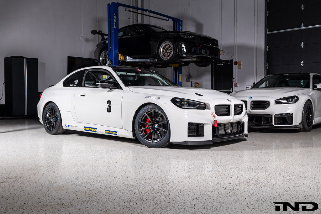 BMW Motorsport G87 M2 Racing black 18x10 wheel set installed on a BMW M2 Racing race car, featuring lightweight motorsport construction, track-focused fitment, and factory BMW Motorsport engineering.
