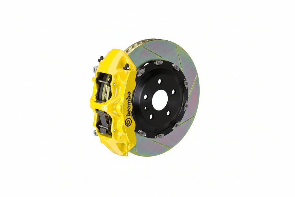 Brembo F85 X5M / F86 X6M GT big brake kit with 405mm slotted front brake rotors and yellow calipers on a BMW SUV.