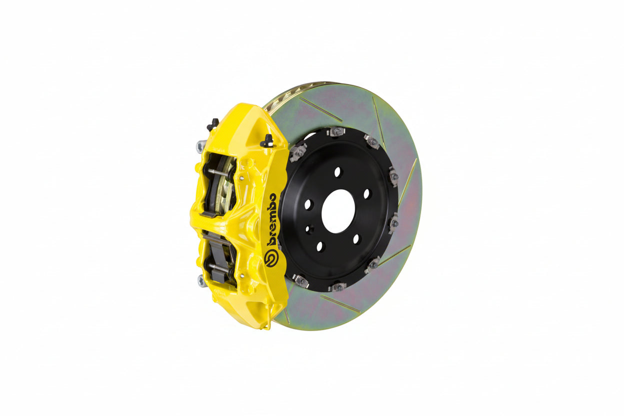 Brembo F85 X5M / F86 X6M GT big brake kit with 405mm slotted front brake rotors and yellow calipers on a BMW SUV.