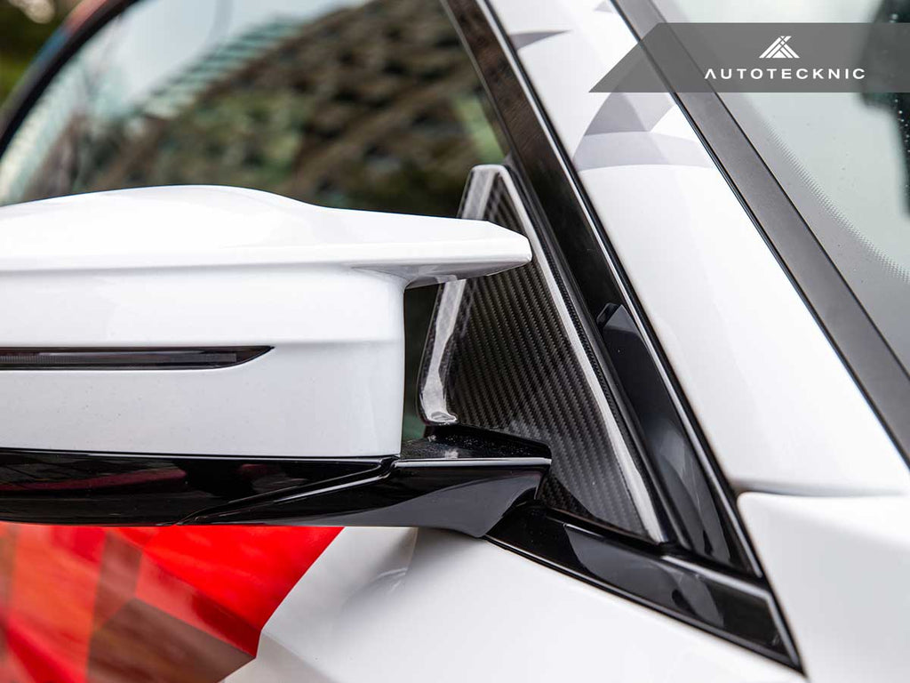 Verus Engineering AutoTecknic G87 M2 dry carbon side mirror wind deflector set on a BMW G87 M2 exterior showing aerodynamic design