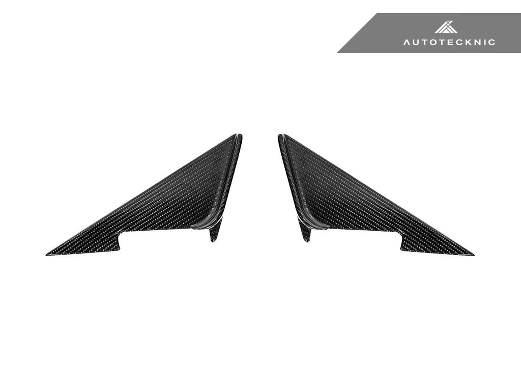 Verus Engineering AutoTecknic G87 M2 dry carbon side mirror wind deflector set on exterior of vehicle, showcasing sleek carbon fiber design.