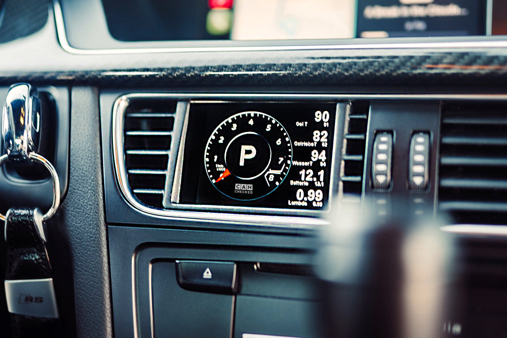 CANchecked MFD28 Gen2 multi function display installed in the air vent of an Audi B8 S4 A4 and 8T S5 A5 interior displaying vehicle data and gauges