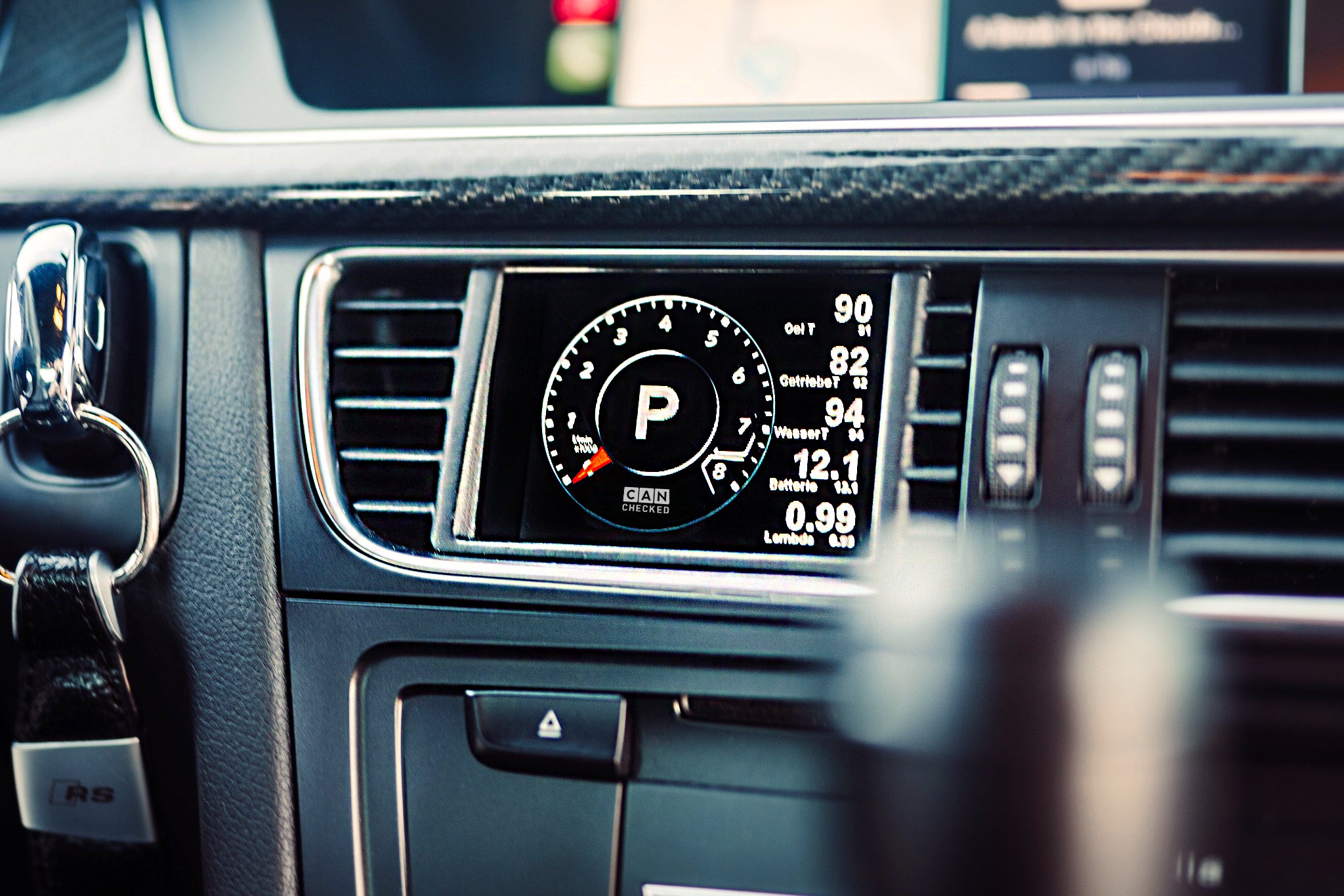 CANchecked MFD28 Gen2 multi function display installed in the air vent of an Audi B8 S4 A4 and 8T S5 A5 interior displaying vehicle data and gauges