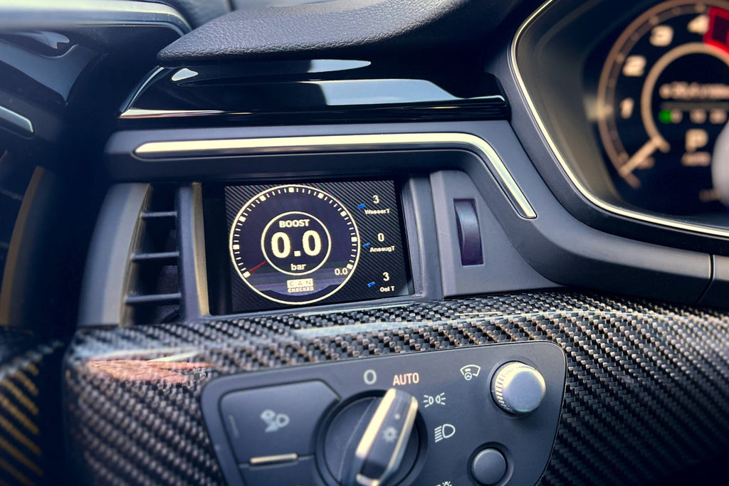 CANchecked MFD28 Gen2 2.8-inch multi-function display installed in an Audi B9 RS4, RS5, S4, or S5 interior, providing touchscreen control, real-time vehicle diagnostics, performance monitoring, and advanced CAN bus data integration through an OEM-style installation.