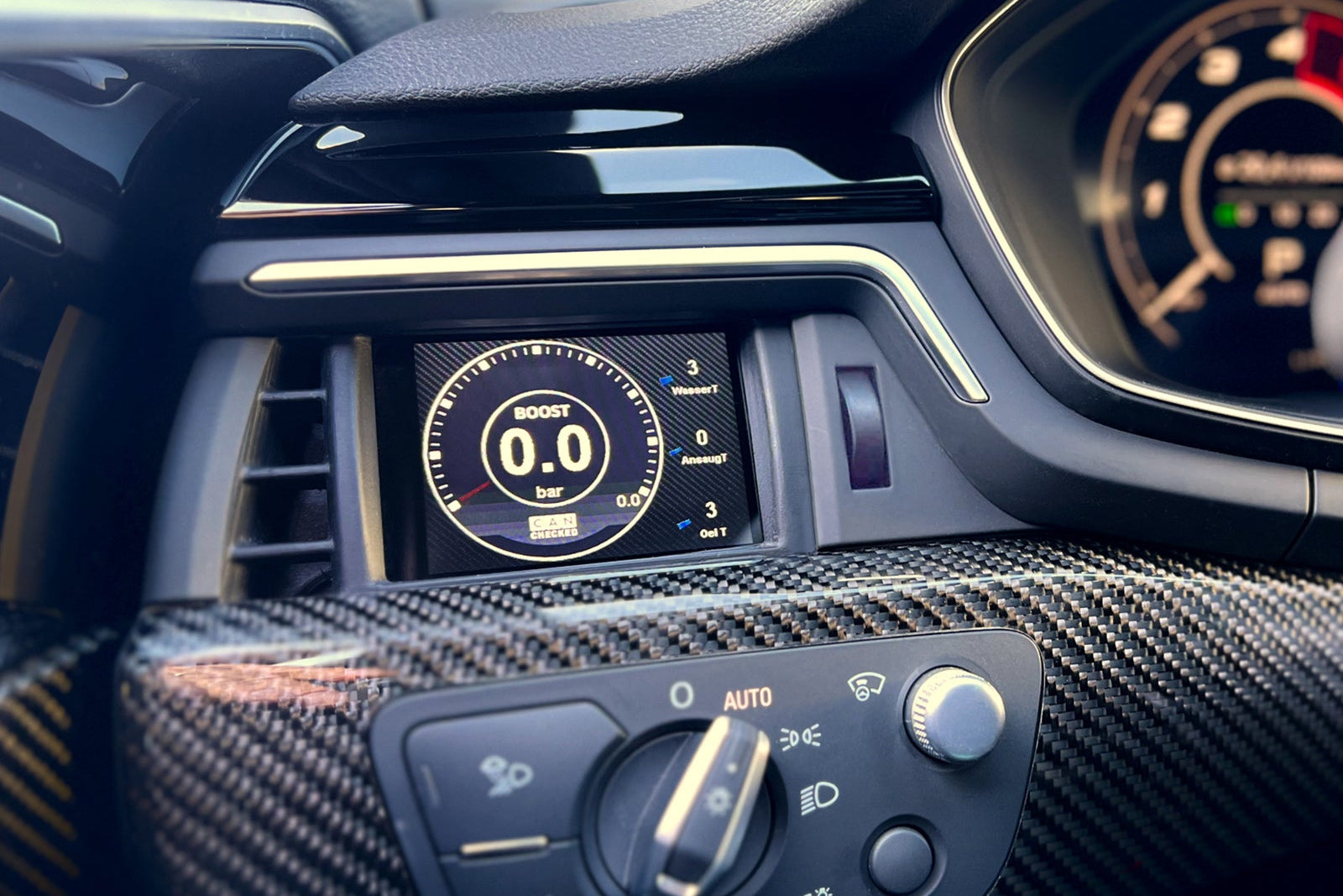 CANchecked MFD28 Gen2 2.8-inch multi-function display installed in an Audi B9 RS4, RS5, S4, or S5 interior, providing touchscreen control, real-time vehicle diagnostics, performance monitoring, and advanced CAN bus data integration through an OEM-style installation.