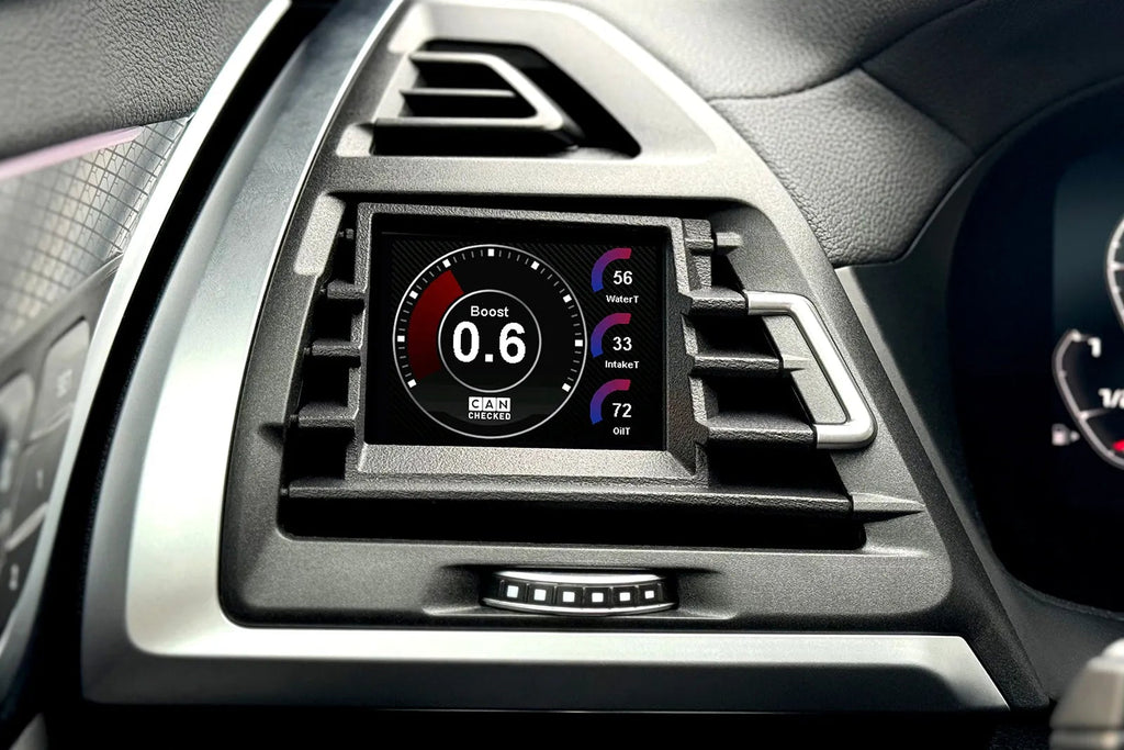 CANchecked MFD28 Multi Function Display installed in BMW F97 X3M and F98 X4M Pre-LCI showing real-time vehicle data and performance monitoring