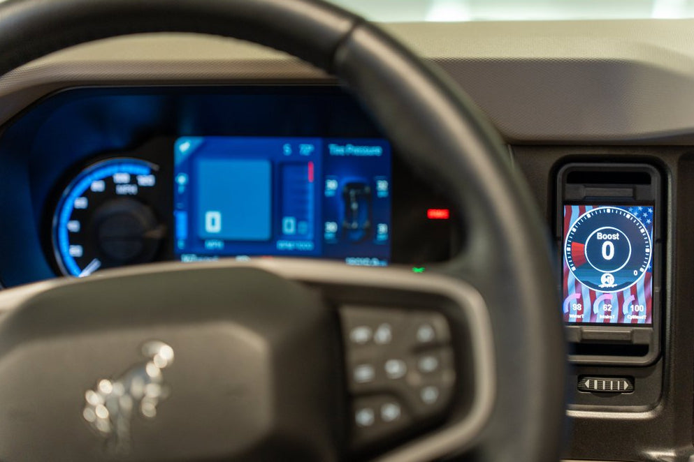 CANchecked MFD32 Gen2 3.2-inch multi-function display installed in the factory dashboard air vent of a Ford U725 Bronco MK6, providing touchscreen control, real-time vehicle diagnostics, performance monitoring, and advanced CAN bus data integration through an OEM-style installation.