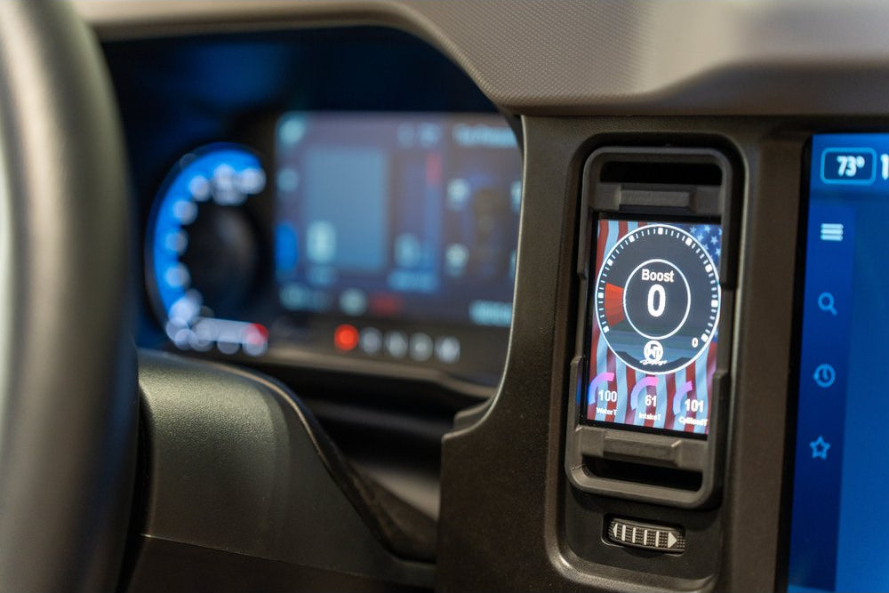 CANchecked MFD32 Gen2 3.2-inch multi-function display installed in the factory dashboard air vent of a Ford U725 Bronco MK6, providing touchscreen control, real-time vehicle diagnostics, performance monitoring, and advanced CAN bus data integration through an OEM-style installation.