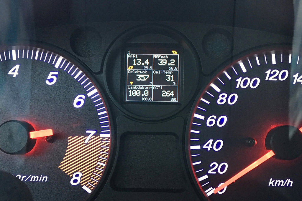 CANchecked MFA2.0 Gen2 multi-function display installed within the factory instrument cluster of a Mazda NA Miata MX-5, providing integrated performance monitoring, vehicle diagnostics, and customizable real-time data display for LHD and RHD vehicles.