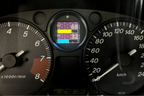 CANchecked MFA2.0 Gen2 multi-function display installed within the factory instrument cluster of a Mazda NA Miata MX-5, providing integrated performance monitoring, vehicle diagnostics, and customizable real-time data display for LHD and RHD vehicles.