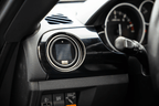 CANchecked MFD15 Gen2 1.5-inch multi-function display installed in a Mazda NC Miata MX-5 interior, providing real-time vehicle diagnostics, performance monitoring, and customizable data display through a vehicle-specific integration.