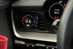 Interior view of CANchecked Porsche 992 911 Multi Function Display 3.2" Gen2 for LHD models, showcasing the digital dashboard screen.