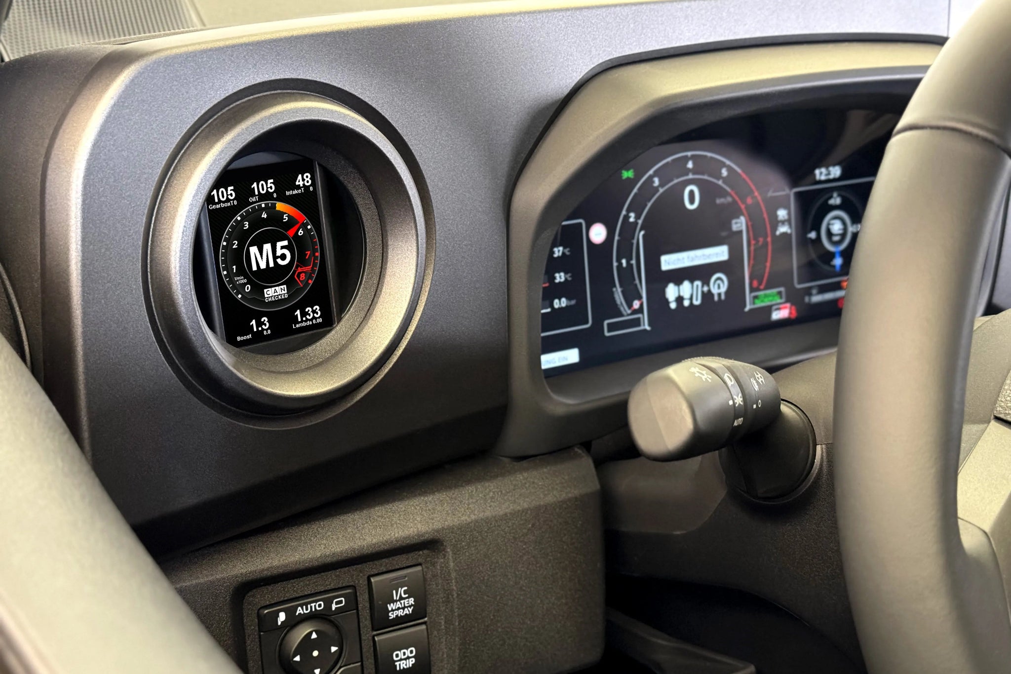 CANchecked MFD28 Gen2 2.8-inch multi-function display installed in a Toyota XP210 GR Yaris or Toyota ZN8 GR86 interior, providing touchscreen control, real-time vehicle diagnostics, performance monitoring, and advanced CAN bus data integration through an OEM-style installation.
