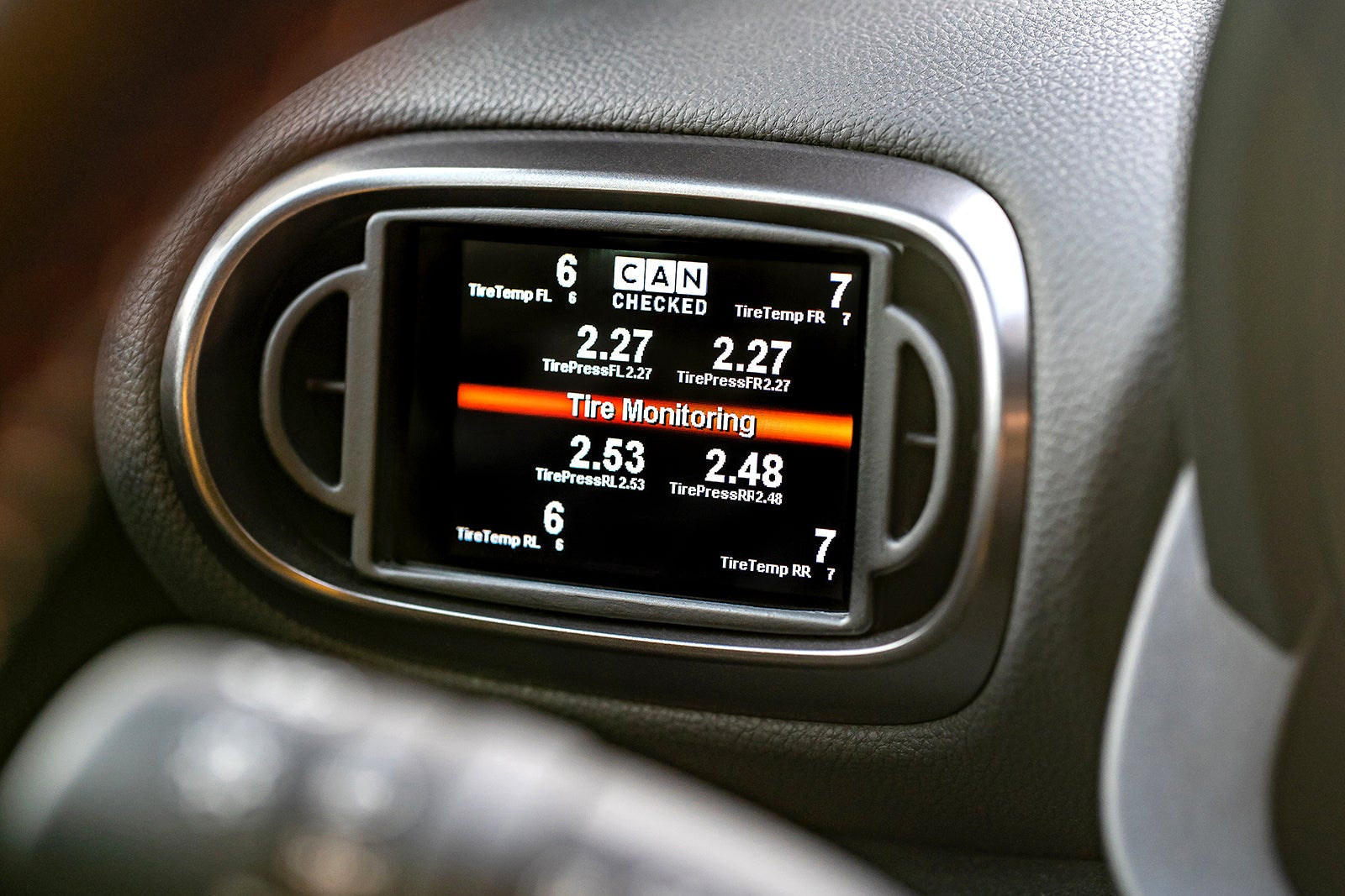 CANchecked MFD32 Gen2 3.2-inch multi-function display installed in a left-hand drive Toyota XP210 Yaris with standalone ECU integration, displaying real-time engine and vehicle data.