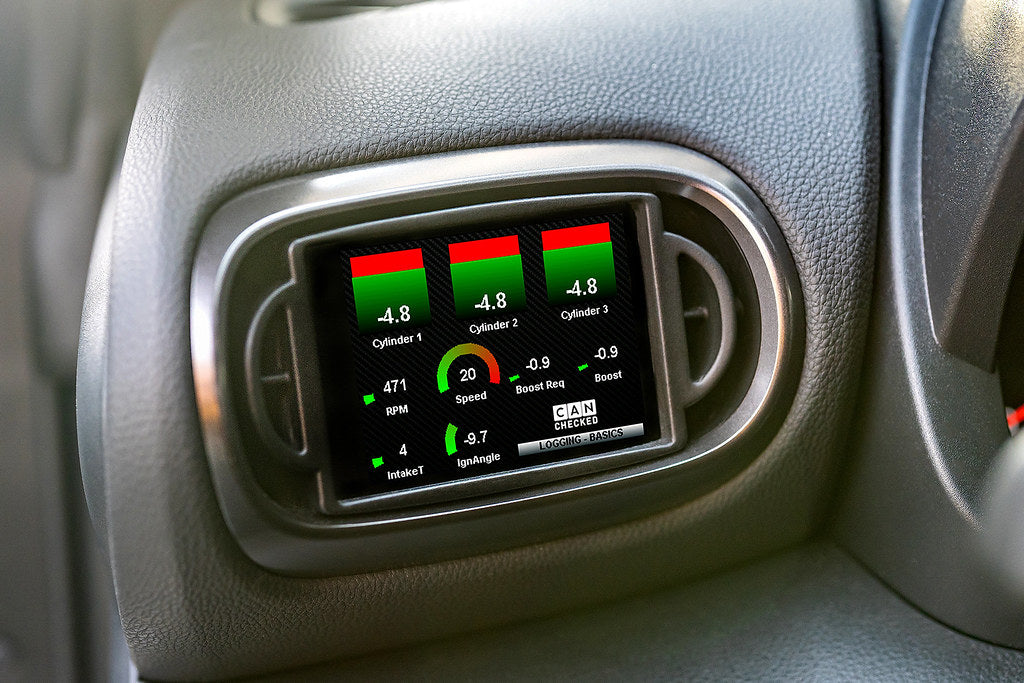 CANchecked MFD32 Gen2 3.2-inch multi-function display installed in a left-hand drive Toyota XP210 Yaris Pre-Facelift, displaying real-time engine and vehicle data with OEM-style dashboard fitment.