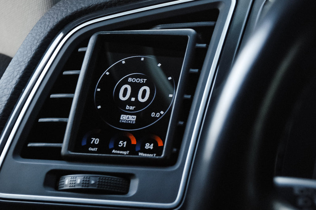 CANchecked MFD28 Gen2 2.8-inch multi-function display installed in a left-hand drive Volkswagen Bus T6, displaying real-time engine and vehicle data with OEM-style dashboard fitment.