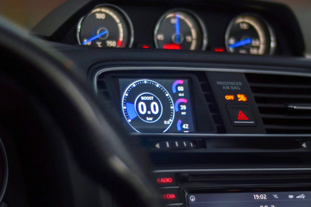 CANchecked MFD28 Gen2 2.8-inch multi-function display installed in a left-hand drive Volkswagen MK3 Scirocco Facelift, displaying real-time engine and vehicle data with OEM-style dashboard fitment.