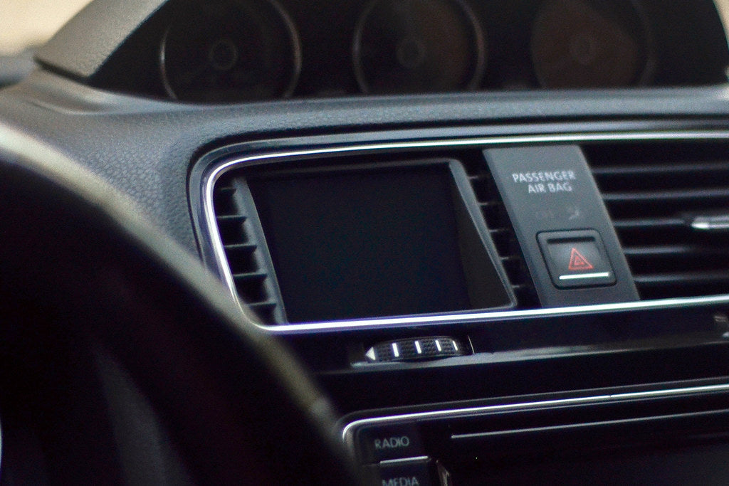 CANchecked MFD28 Gen2 2.8-inch multi-function display installed in a left-hand drive Volkswagen MK3 Scirocco Facelift, displaying real-time engine and vehicle data with OEM-style dashboard fitment.