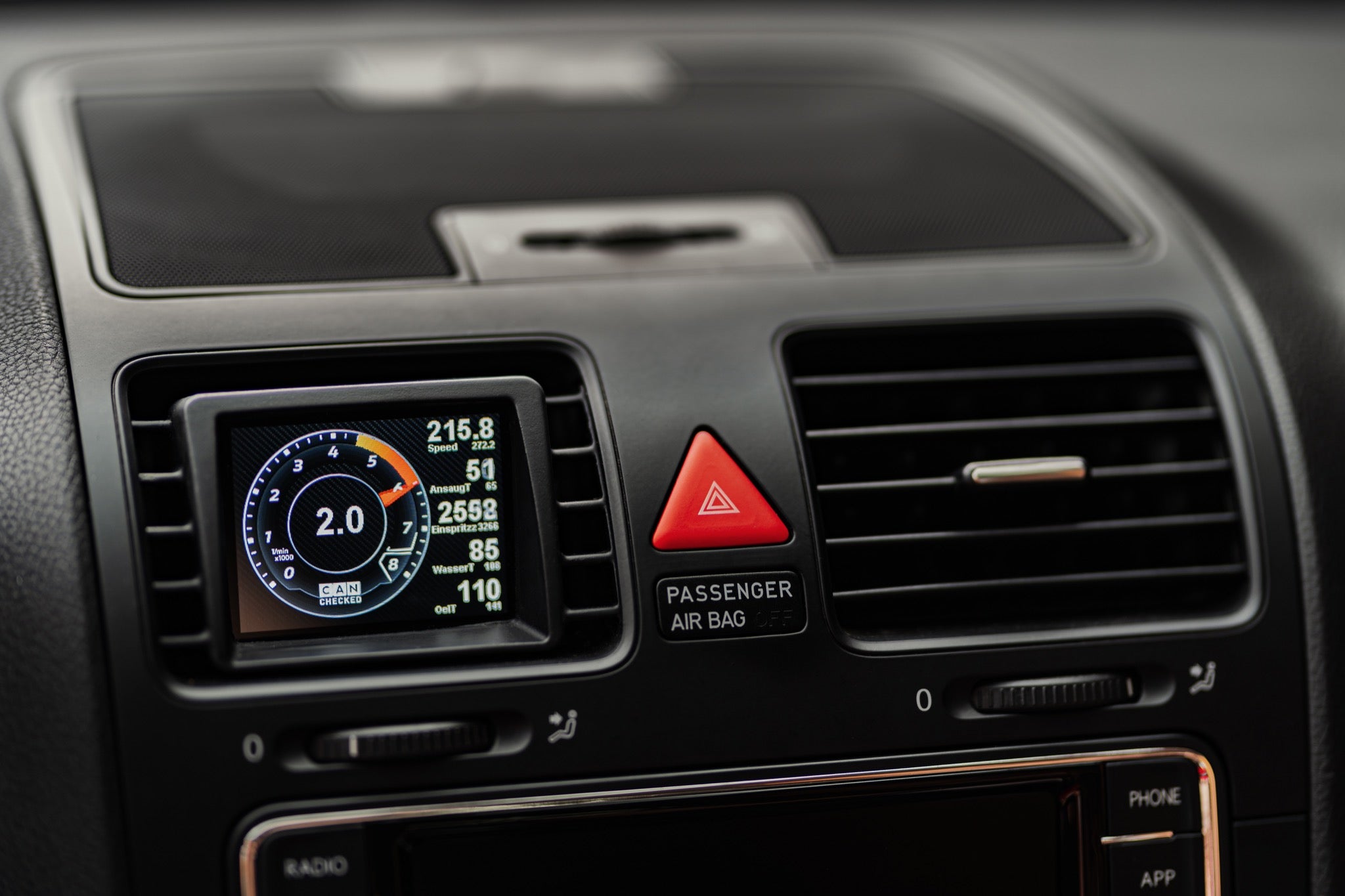 CANchecked MFD32 Gen2 3.2-inch multi-function display installed in the factory air vent of a Volkswagen MK5 Golf, providing touchscreen control, vehicle diagnostics, performance monitoring, and real-time CAN bus data through an OEM-style integration.