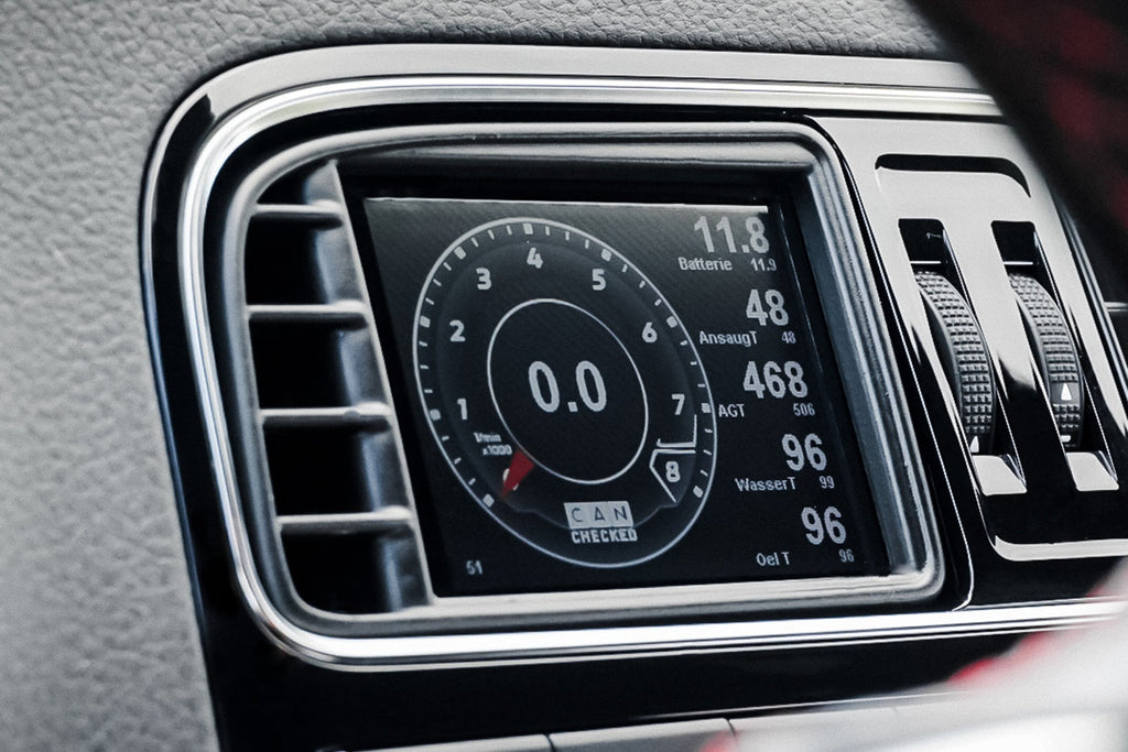 CANchecked MFD32 Gen2 3.2-inch multi-function display installed in a left-hand drive Volkswagen MK5 Polo GTI, displaying real-time engine and vehicle data with OEM-style dashboard fitment.