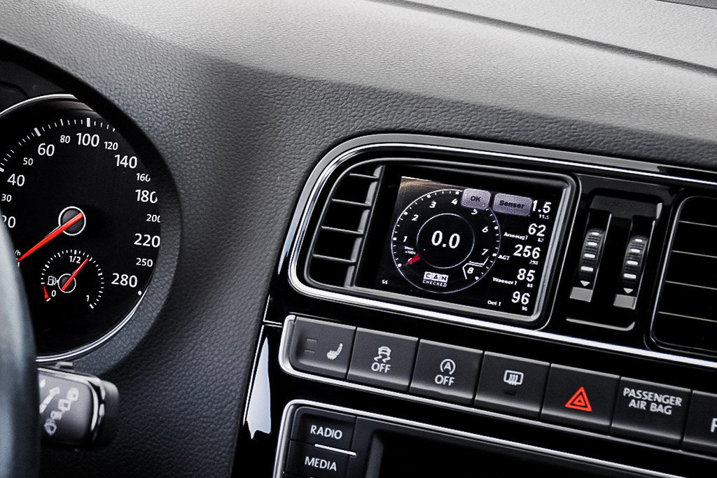 CANchecked MFD32 Gen2 3.2-inch multi-function display installed in a left-hand drive Volkswagen MK5 Polo GTI, displaying real-time engine and vehicle data with OEM-style dashboard fitment.