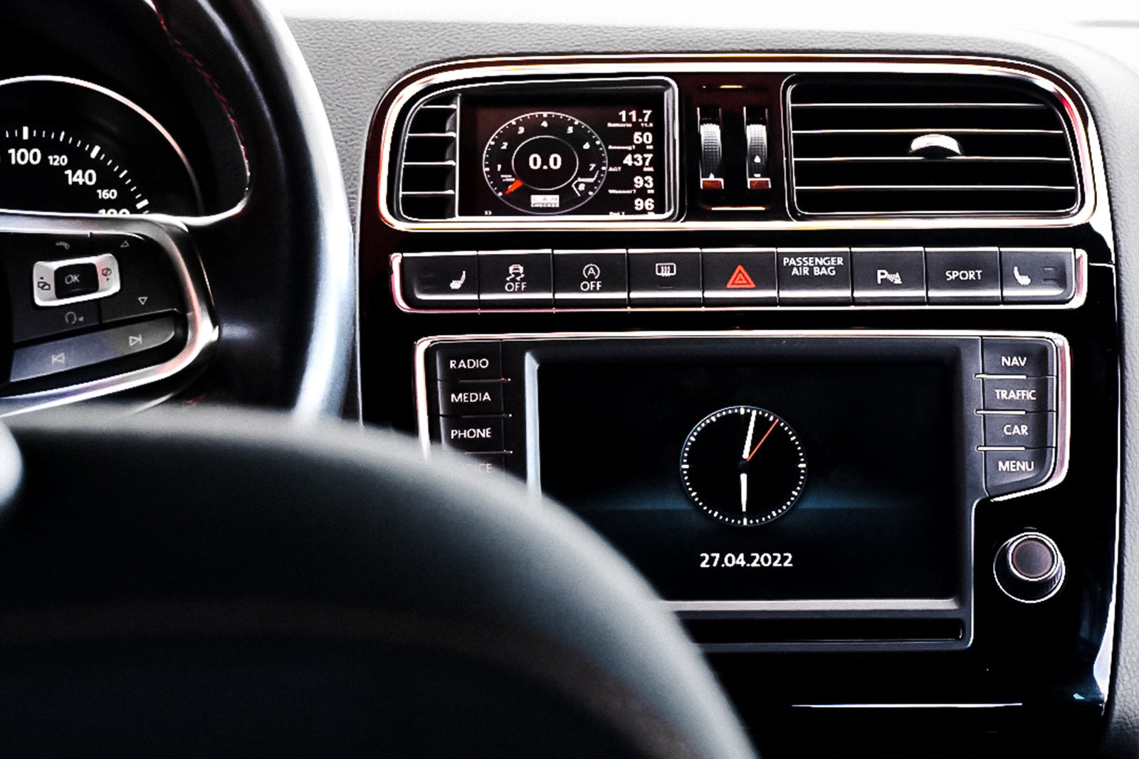 CANchecked MFD32 Gen2 3.2-inch multi-function display installed in a left-hand drive Volkswagen MK5 Polo GTI, displaying real-time engine and vehicle data with OEM-style dashboard fitment.