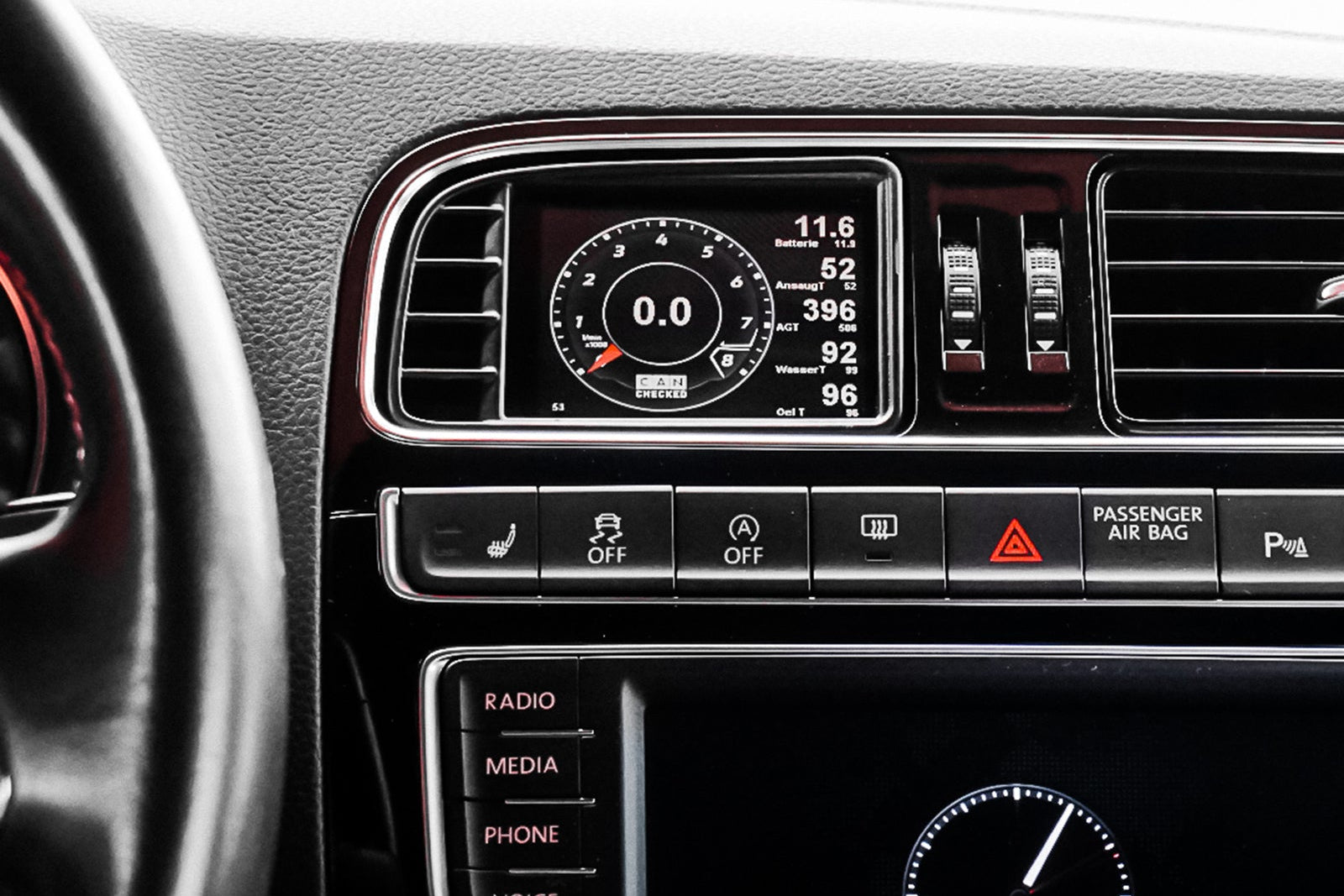 CANchecked MFD32 Gen2 3.2-inch multi-function display installed in a left-hand drive Volkswagen MK5 Polo GTI, displaying real-time engine and vehicle data with OEM-style dashboard fitment.
