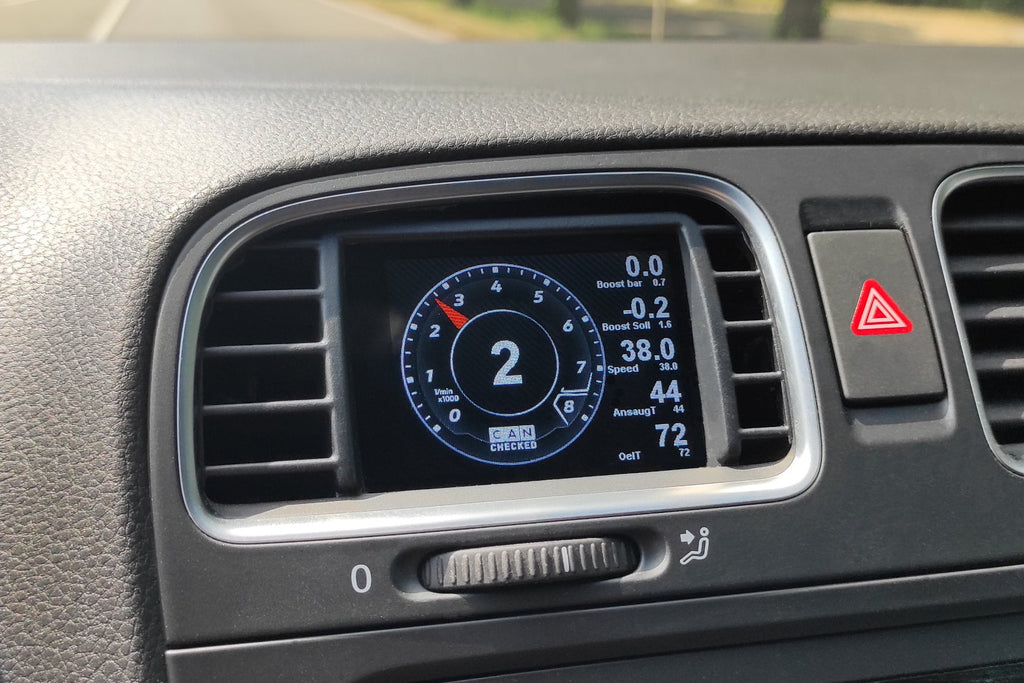CANchecked MFD28 Gen2 2.8-inch multi-function display installed in a Volkswagen MK6 Golf dashboard, providing real-time vehicle diagnostics, performance monitoring, and customizable data visualization through a factory-style integration.