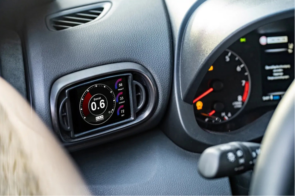 Toyota Yaris XP210 pre-facelift multi-function display by CANchecked, 3.2-inch Gen2 interior LCD screen, LHD model.