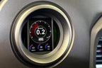 CANchecked XP210 GR Yaris 2024+ and ZN8 GR86 multi-function display in interior view, showing digital gauges on a 2.8-inch screen.