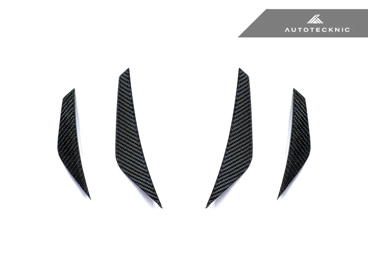 AutoTecknic G8X M3 M4 dry carbon canard set installed on the exterior of a vehicle, showcasing aerodynamic enhancements.