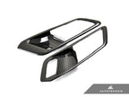 AutoTecknic G8X M3 M4 dry carbon interior door handle trim set on car door panel, showcasing sleek, lightweight carbon fiber design