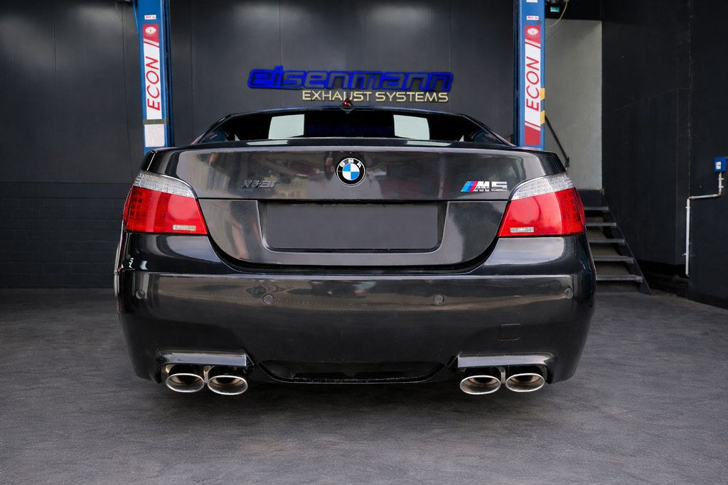 Eisenmann valved stainless steel exhaust installed on BMW E60 M5 highlighting quad tips and performance rear mufflers