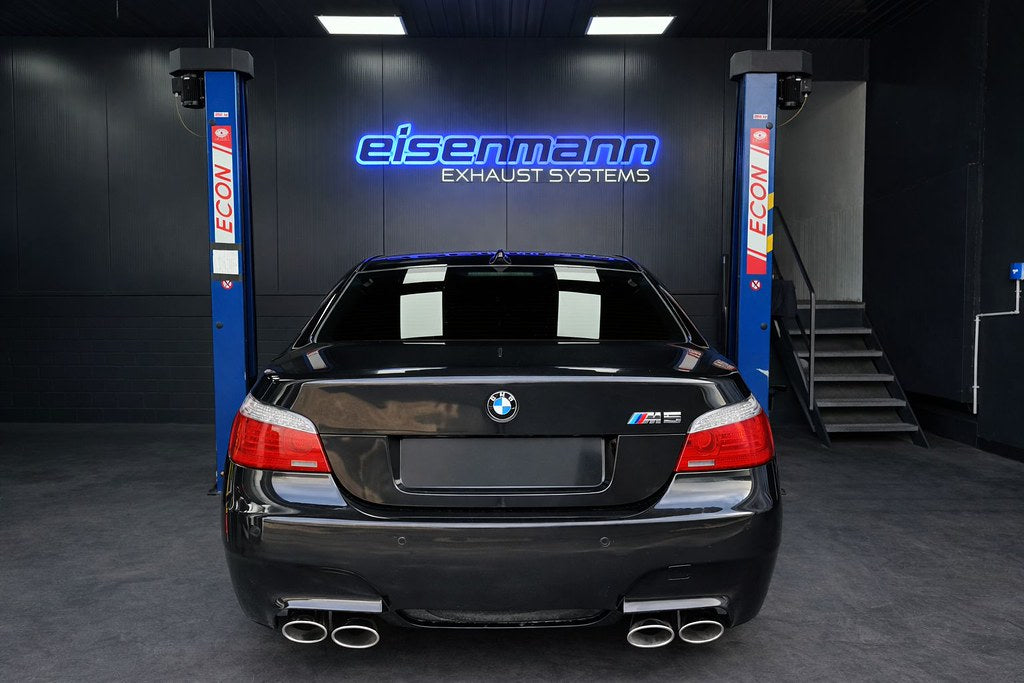 Eisenmann valved stainless steel exhaust installed on BMW E60 M5 highlighting quad tips and performance rear mufflers