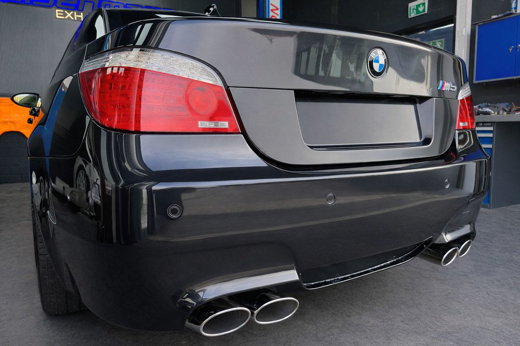 Eisenmann valved stainless steel exhaust installed on BMW E60 M5 highlighting quad tips and performance rear mufflers