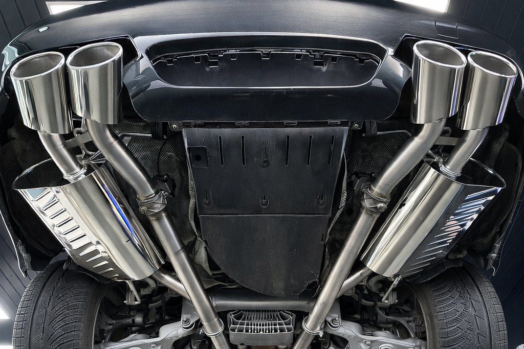 Eisenmann valved stainless steel exhaust installed on BMW E60 M5 highlighting quad tips and performance rear mufflers