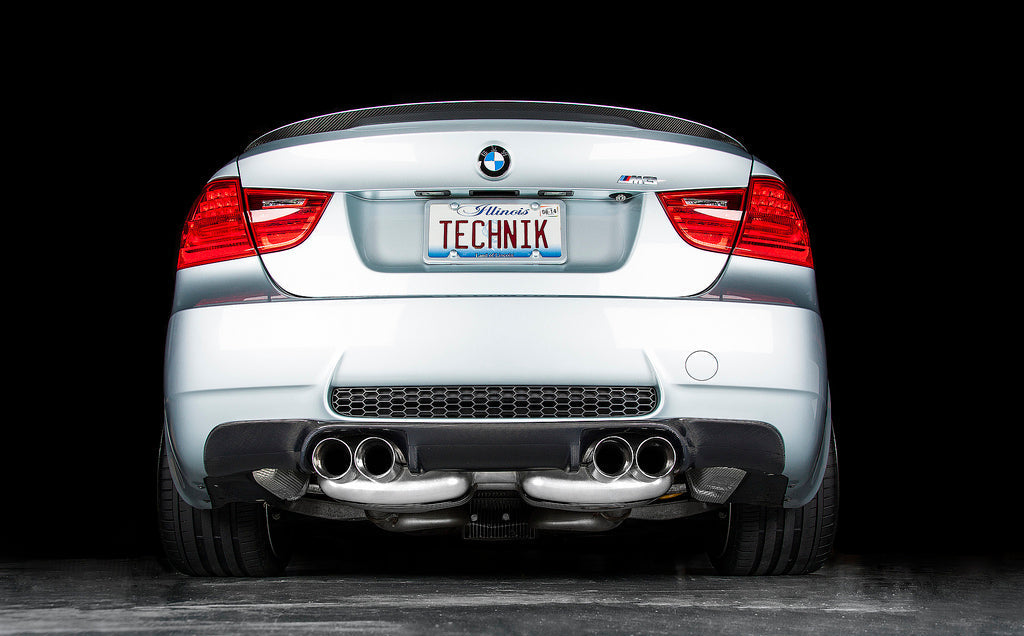 Eisenmann E90 M3 performance exhaust system with polished metal tips and sleek exhaust pipes, installed on a BMW E90 M3.