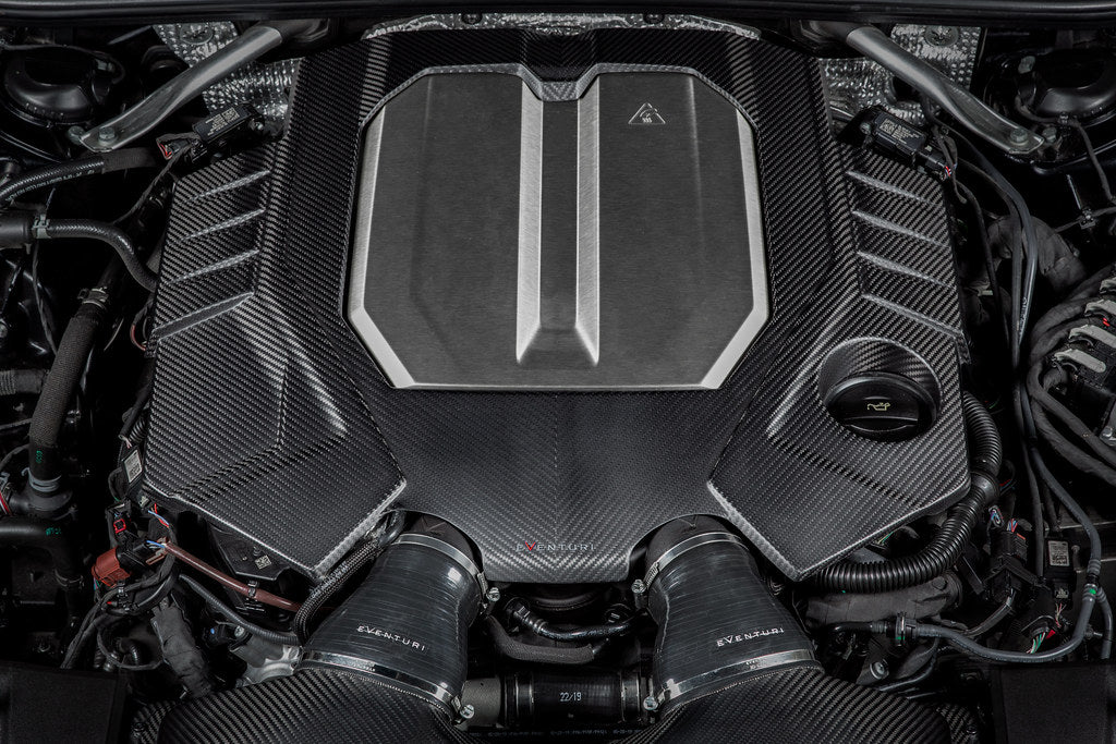 Eventuri black matte carbon engine cover installed on Audi C8 RS6 and RS7, showcasing sleek exterior engine bay detail.