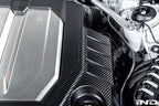 Eventuri black matte carbon engine cover installed on Audi C8 RS6 and RS7 exterior, showcasing sleek, high-performance design.