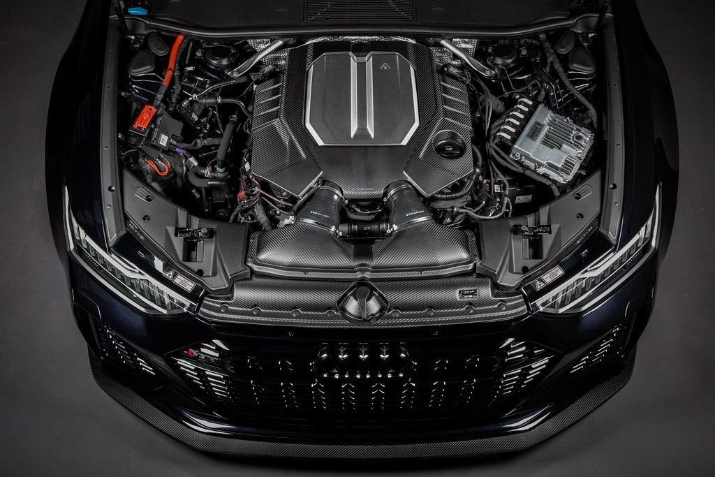 Eventuri black carbon engine cover installed on Audi C8 RS6 and RS7 exterior, showcasing matte carbon finish.