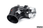Close-up of Eventuri carbon turbo inlet set for BMW G90 G99 M5 S68, showing glossy fittings and performance components.