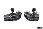 Eventuri carbon turbo inlet set for BMW G90 G99 M5 S68, showcasing glossy black carbon fiber components on a performance engine.