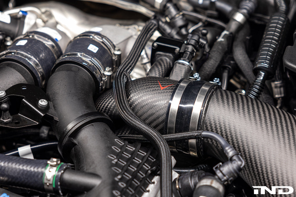 Eventuri BMW G90 G99 M5 S68 carbon turbo inlet set, matte finish, close-up view of installed performance inlet system.
